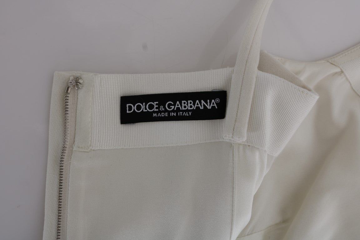 Dolce &amp; Gabbana Elegancka biała wełniana sukienka typu shift z broszką w kolorze złotym